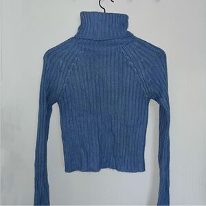 Blue woolen cropped sweater with long sleeves and a turtleneck